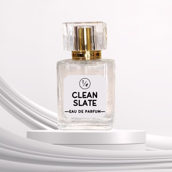 Clean Slate eau de parfum bottle on a white platform against a white background