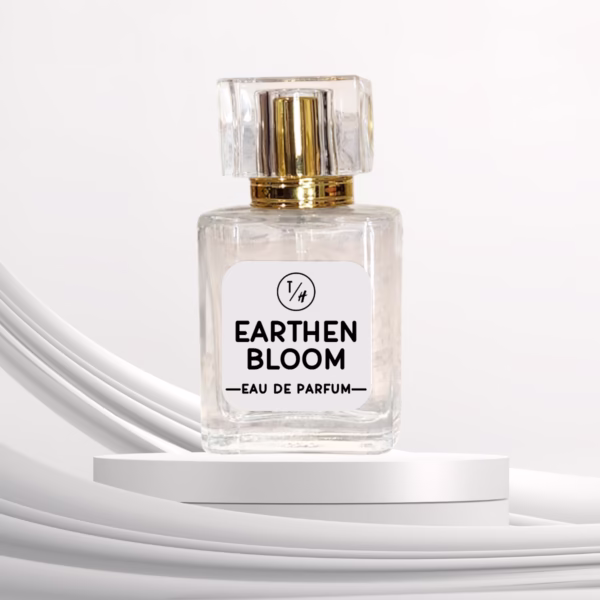 Earthen Bloom eau de parfum bottle on a white platform against a white background