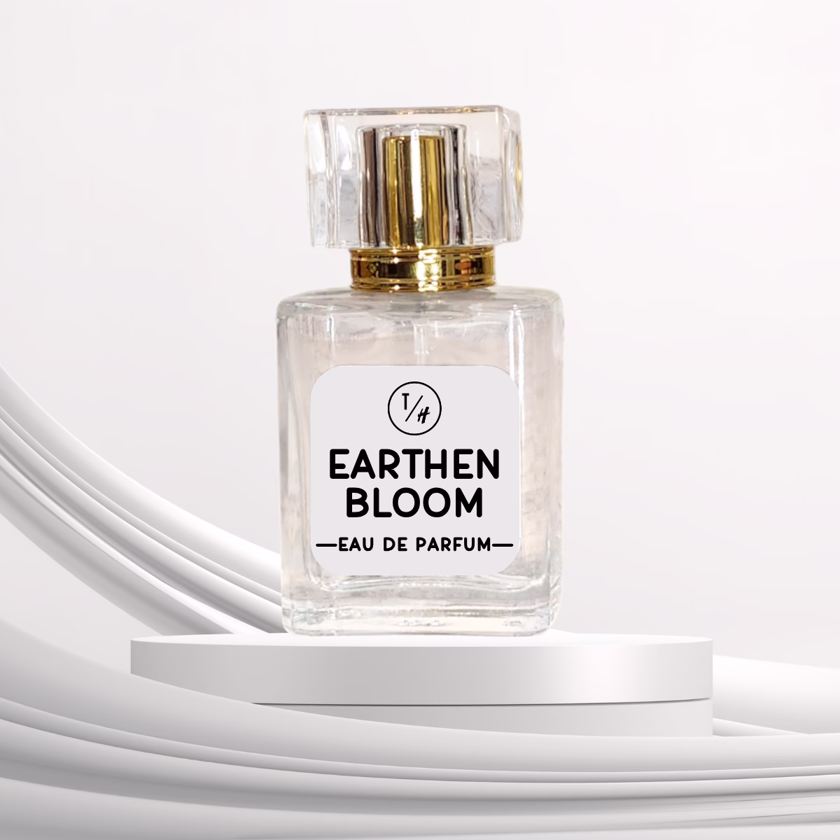 Earthen Bloom eau de parfum bottle on a white platform against a white background