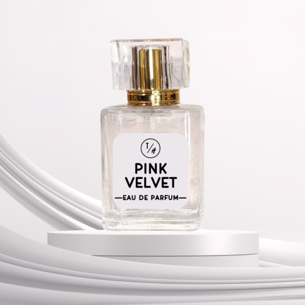 Pink Velvet eau de parfum bottle on a white platform against a white background